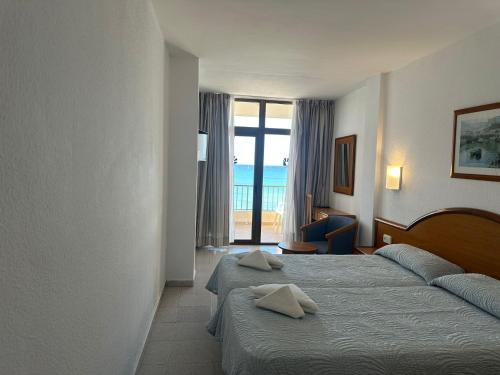 En eller flere senge i et værelse på Hotel Marina Playa De Palma