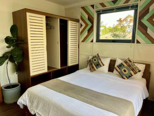 En eller flere senge i et værelse på The Scent Boutique Dalat Hotel