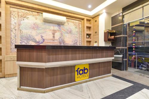 a store with a foto inputs sign on the wall at FabHotel The Grand Manmuralidhar - Hawa mahal 3 km, Chandpol metro station in Jaipur