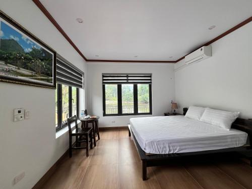En eller flere senge i et værelse på Tam Coc Mountain Light Homestay