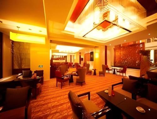 Posezení v ubytování Ramada Plaza by Wyndham Yangzhou Casa