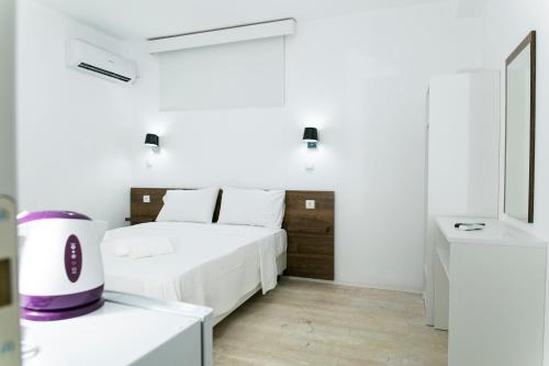 Кровать или кровати в номере Kissamia Rooms - Next to Night Clubs
