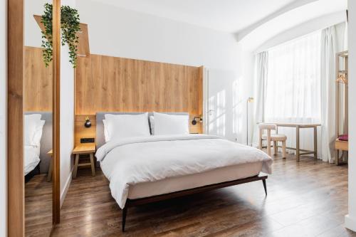 En eller flere senge i et værelse på FortyPlusOne Hotel Vienna