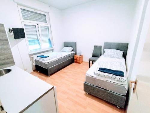 Postel nebo postele na pokoji v ubytování Apartment Haus