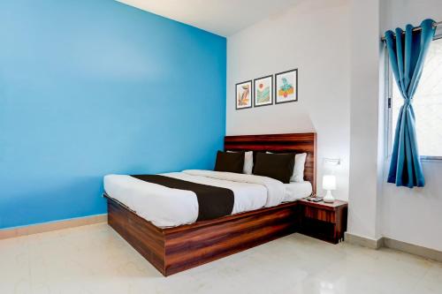 En eller flere senge i et værelse på Hotel O by OYO Ranchi Retreat