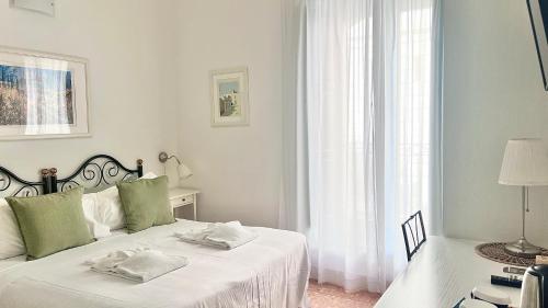 Rúm í herbergi á Hotel Posta