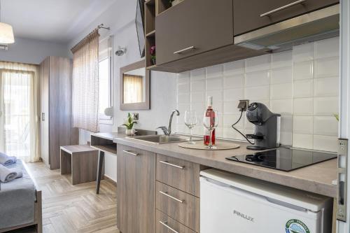 a kitchen with a sink and a counter top at Dream Studios in Stavros