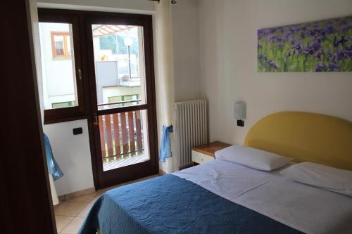 Postel nebo postele na pokoji v ubytování Lanterna Apartment 1