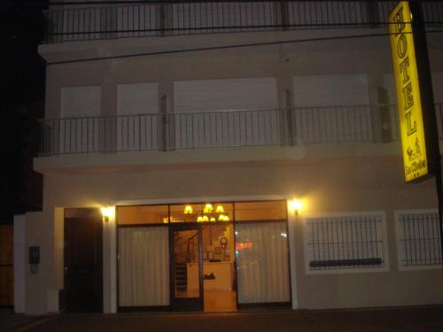 a white building with a balcony on top of it at La Cibeles in Miramar