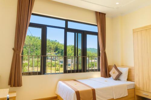 Cama o camas de una habitación en Đức Khôi Hotel