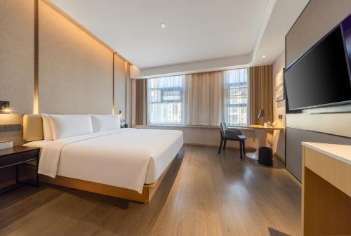 Una cama o camas en una habitación de Atour X Hotel Zaozhuang High-Railway Station