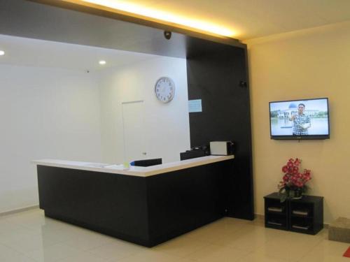 TV a/nebo společenská místnost v ubytování One Home Hotel