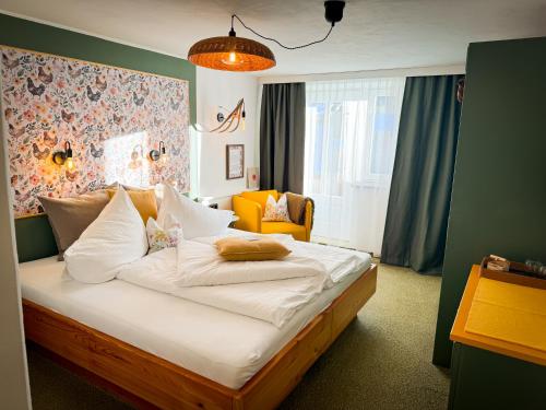 Postel nebo postele na pokoji v ubytování Hotel Tenne