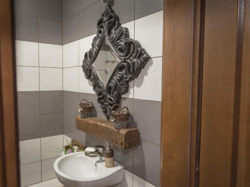 a bathroom with a sink and a mirror at Apartments Djurovic in Virpazar
