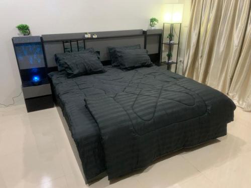 En eller flere senge i et værelse på JRJ Residence