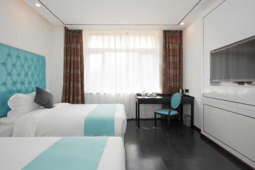 Postel nebo postele na pokoji v ubytování Xana Lite Beijing West Station Branch