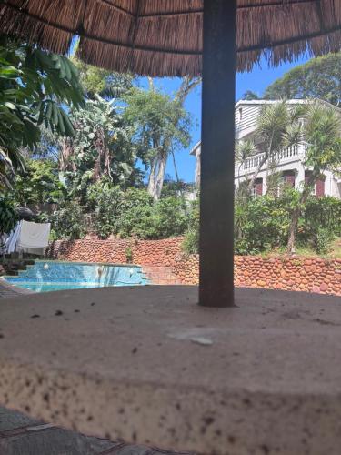 a resort with a swimming pool and a building at The Easy Stay in Durban