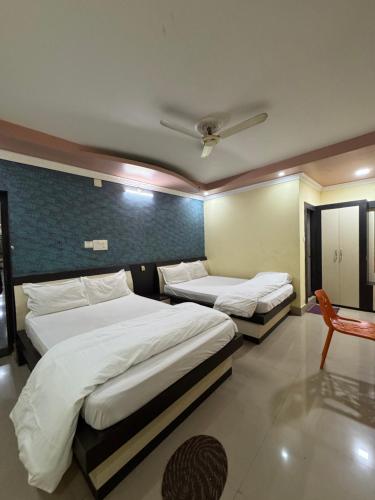 Giường trong phòng chung tại Hotel Lisa Galaxy