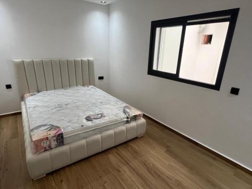 Giường trong phòng chung tại Duplex Menara Garden 2