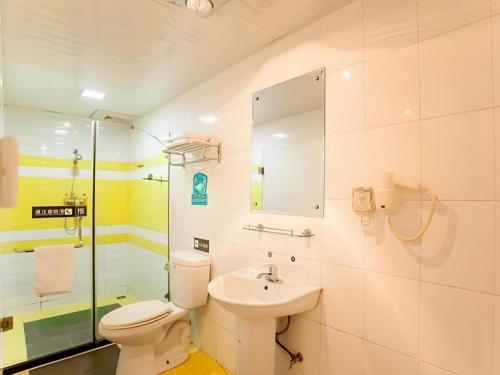 a bathroom with a toilet and a sink at 7 Days Premium Zibo Jinjing Avenue the Mixc in Zibo