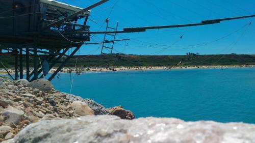 a view of a beach with people on the shore at Le Pietre Ricce B&B in Roccamontepiano