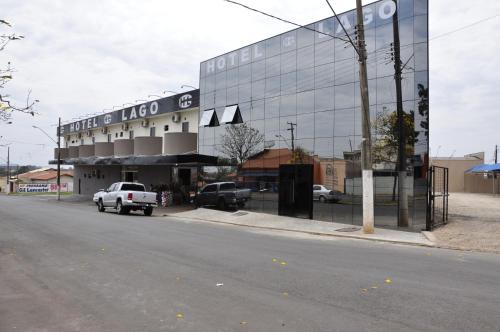 a white truck parked in front of a building at Hotel Lago Conchal in Conchal