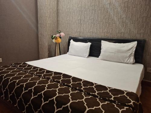 Postel nebo postele na pokoji v ubytování Blueberry Heritage Residency