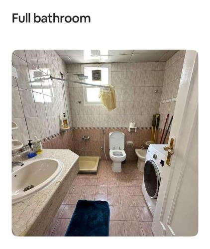 a bathroom with a sink and a toilet at Villa Terrace Master Room Abu Dhabi 2nd floor in Abu Dhabi
