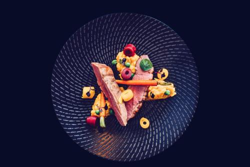 a plate of food with food on it at Hotel Scout in Częstochowa