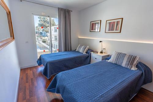 En eller flere senge i et værelse på Villa Playa Esperanza by Rentallorca