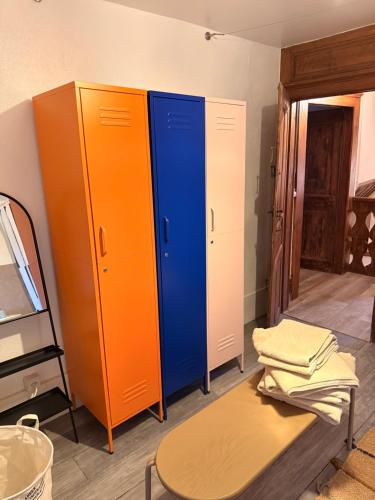 a room with two storage cabinets and a table at Domaine à la Loëx in Geneva