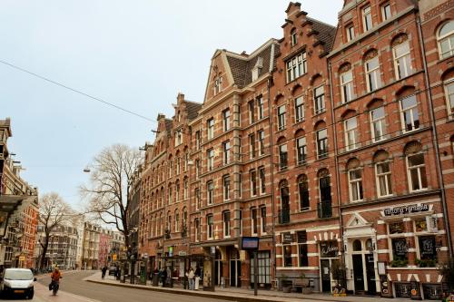 a row of buildings on a city street at Hotel La Bohème in Amsterdam