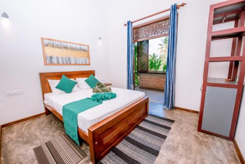 Un pat sau paturi într-o cameră la Sithagi Villa Unawatuna