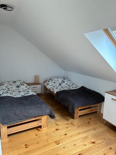 Postel nebo postele na pokoji v ubytování Apartament na lipowej