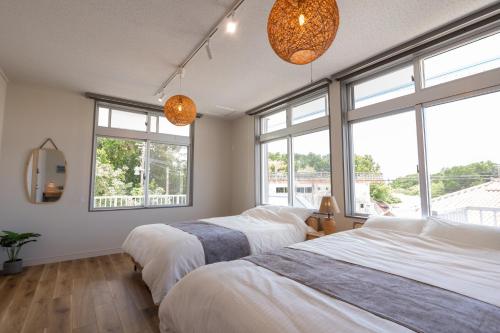 Кровать или кровати в номере 栞-shiori-FUNAKURA