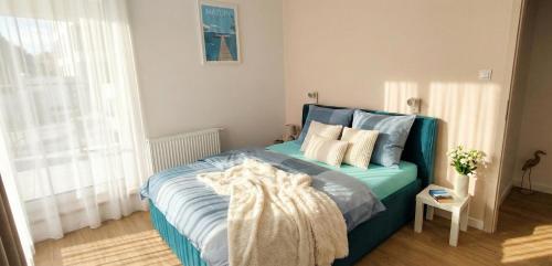 Postel nebo postele na pokoji v ubytování Mazurski relax plus Taras Garaż podziemny