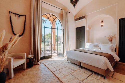 En eller flere senge i et værelse på Villa Sumaïa - Maison de caractère, Boutique Hotel