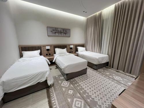 a hotel room with two beds in a room at جده شارع صاري in Jeddah