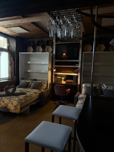 a bedroom with two beds and a table and chairs at VIP Apart Gorlice in Gorlice