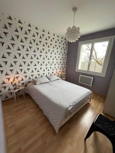 En eller flere senge i et værelse på Gite Vintage 63 Le Hameau 1936