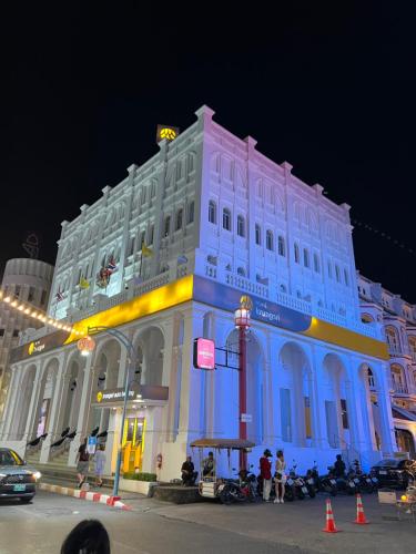 a large white building with blue lights on it at Queen On Street 2009 in Ban Lo Long
