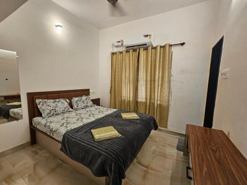 Postel nebo postele na pokoji v ubytování Rock Finch Holiday Homes - Malpe Beach