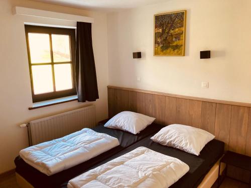 Ένα ή περισσότερα κρεβάτια σε δωμάτιο στο De Molenhoeve Gezinswoning