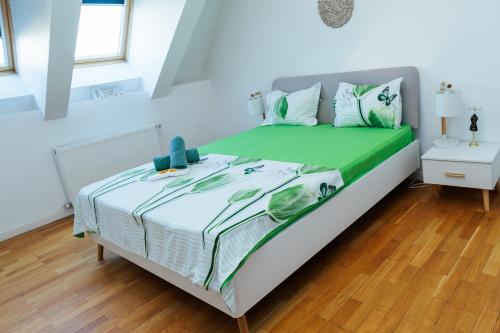 En eller flere senge i et værelse på Bucharest Central DD Apartment