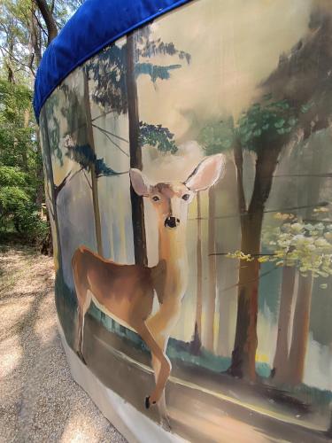 a painting of a deer on the side of a building at Jurta Na Skraju Lasu in Zawady