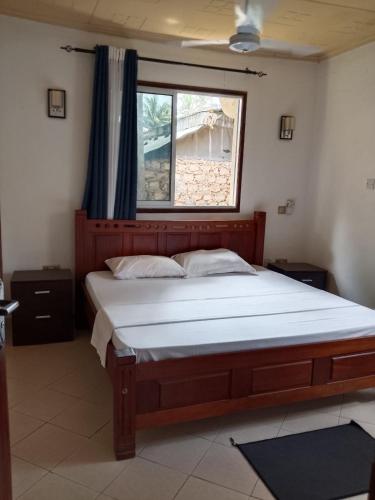 En eller flere senge i et værelse på majaoni villa