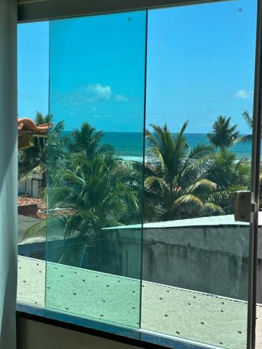 a view of the beach from an office window at CASA DE PRAIA COM PISCINA EM ILHÉUS-BA a 50m DA PRAIA in Ilhéus
