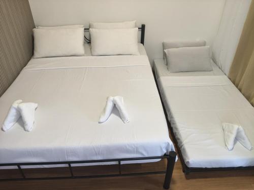 Giường trong phòng chung tại L & Ev Be My Guest