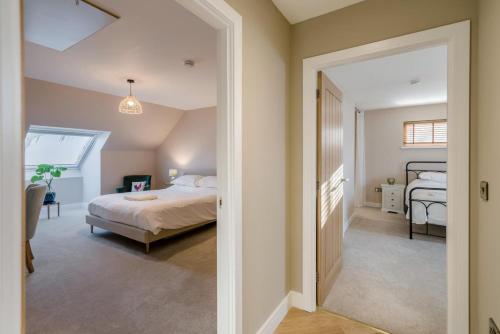 een slaapkamer met een bed en een hal bij 5 Bed in Spean Bridge oc-t34246 in Spean Bridge