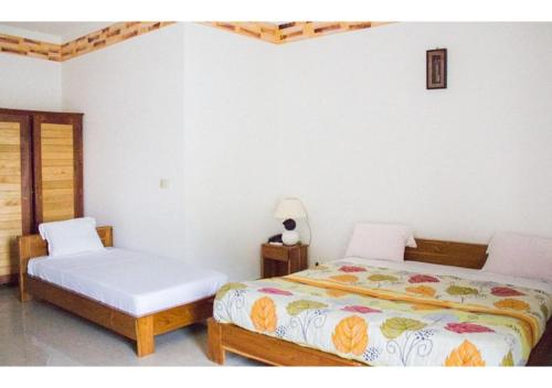 Rúm í herbergi á Hotel La Marsu